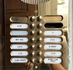 a close up of an old style phone with buttons and numbers on the front panel