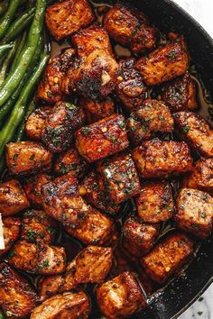 the meal is prepared and ready to be eaten on the grill, including green beans