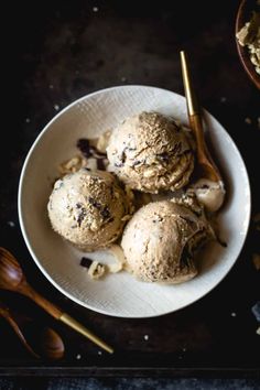 three scoops of ice cream in a white bowl