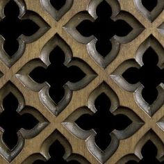 a close up view of an intricate design on a wood paneled wall or door