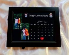 an anniversary photo frame with two pictures on it