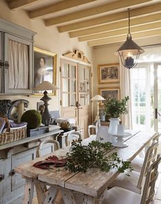 a kitchen with an old table and chairs