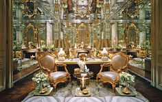 an elaborately decorated dining room is shown in this image, with chairs and tables