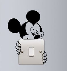 a mickey mouse light switch sticker on the wall