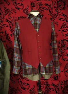 More items at www.newfanglednatty.com  A lovely country set. Vintage DAKS red wool waistcoat with viscose lining made in England, with traditional leather conker buttons. Matching vintage plaid country wool shirt by Hebden Cord made in England.  -   fits as a 40 inch medium. See measurements below. - Condition: light use Approximate sizes when laid flat Please check the measurements to a similar garment that you own to ensure a good fit.   waistcoat: Underarm to underarm:- 21 1/4 " Classic Plaid Vest For Fall, Plaid Cotton Vest For Fall, Fall Plaid Cotton Vest, Tailored Vintage Winter Vest, Winter Tailoring Vest With Buttons, Tailored Vintage Fall Vest, Classic Red Winter Vest, Fitted Wool Vest For Fall, Single Breasted Long Sleeve Vest For Winter