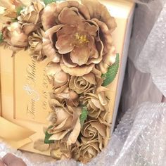 a close up of a box with flowers on it