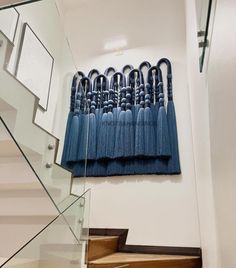 a blue curtain hanging on the side of a stair case