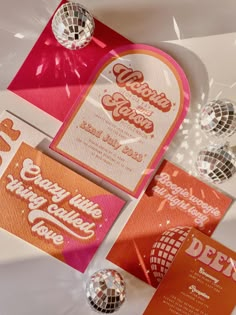 an orange and pink wedding suite with disco balls