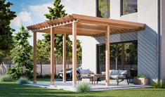 an outdoor patio with wooden pergoline and seating area next to a house in the background