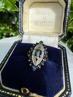 Vintage 9ct yellow gold diamond accented sapphire ring, marquise shape, UK size L, US size 5.75. Weight 3.8g. The band is minimally misshapen, otherwise in perfect condition. Setting size 2cm x 1.4cm. An absolute stunner. Marquise Shape Ring, Luxury Gold Sapphire Ring Engraved, Art Deco Vintage Ring, Antique Sapphire Ring, Vintage Rings Antiques, Safire Rings, Sapphire Ring Vintage, Vintage Sapphire Ring, Saphir Ring