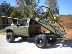 a pick up truck with a ladder on the back