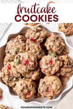 a white bowl filled with cookies on top of a table next to a red and white napkin