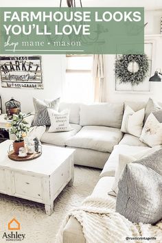 a living room filled with white furniture and lots of pillows on top of the couch