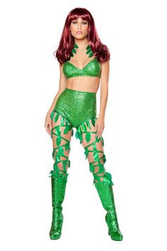 a woman in a green costume posing for the camera with her hands on her hips