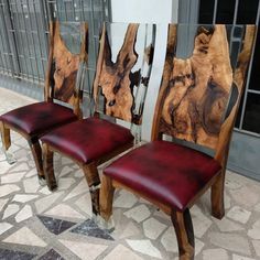 two wooden chairs sitting next to each other