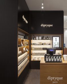 an empty store with lots of items on display in front of the counter and shelves