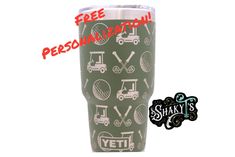 a green tumbler cup with golf symbols on it and the words free personalization