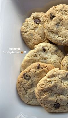 chocolate chip cookies in a white bowl on a table