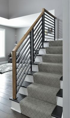 the stairs in this house are made of metal and wood