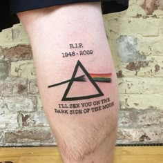 a man's leg with a pink floyd tattoo on it and the words, ill see you on the dark side of the moon