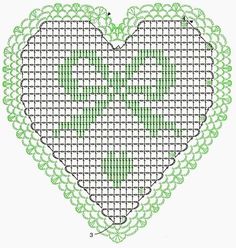 a cross stitch heart is shown in green