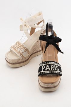 Step into paradise with our Paris Embroidered Upper Wedge Heel! With intricate embroidery and a comfortable wedge heel, these shoes will transport you to the French Riviera without ever leaving your neighborhood. Say oui to style and comfort. * DETAILS:  Embroidered upper woven strap with city landmarks Wrapped ankle strap with bow Jute braided ankle back support Jute-wrapped espadrille platform Rubber outsole 4 inch heel height 2 inch platform height Black Paris, Comfortable Wedges, Espadrilles Platform, The French Riviera, Moms Club, Intricate Embroidery, 4 Inch Heels, French Riviera, Denim Flares