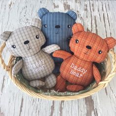 three teddy bears sitting in a basket with the words daddy bear written on one of them