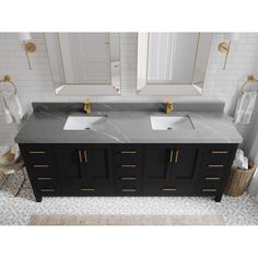 two sinks and mirrors in a bathroom with white tiles on the floor, gold accents