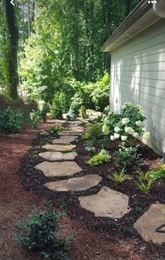 a stone path in front of a house