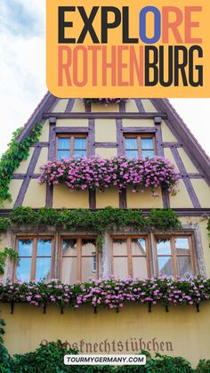 an old building with flowers growing on it and the words explore rothenburg in german