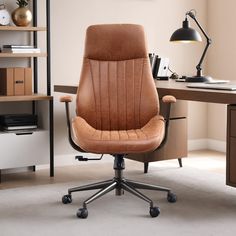 an office chair sitting in front of a desk with a lamp on top of it