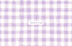 a purple and white checkered pattern with the words one day at a time