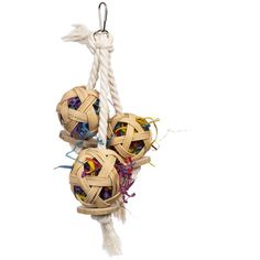 three wooden balls hanging from a rope on a white background with other items in it