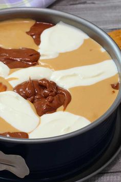 a pan filled with chocolate and marshmallows on top of a table