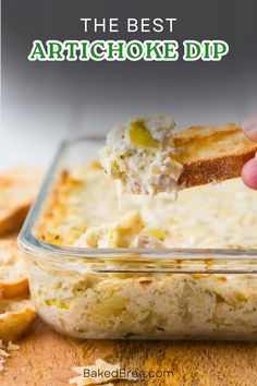 the best artichoke dip recipe in a glass dish with crackers on the side