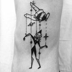 a black and white photo of a person with a kite tattoo on their back leg