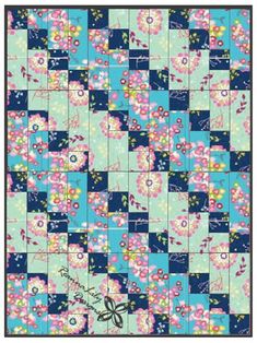 a blue and pink quilt with flowers on the front, in an ornate pattern that has been