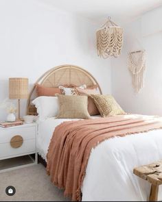 a bedroom with a bed, nightstand and lamp