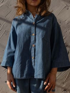 Meet our best-selling Linen Shirt, now in soft, denim chambray! This relaxed-fit button down-shirt for women has wide sleeves and a boxy fit that makes it the perfect everyday piece for the warm weather. We love it paired with The Chambray Denim Short or The Wide Leg Jean.Our small-batch wash process means that each of our denim garments will vary slightly in color and appearance.• Composition: 100% cotton• Available in: MID DENIM• US sizes: XS (US 0–2), S (US 4–6), M (US 8–10), L (US 12–14), XL Relaxed Fit Light Wash Denim Top For Day Out, Washed Blue Chambray Button-up Denim Top, Relaxed Fit Light Wash Denim Top, Light Wash Denim Top For Everyday, Medium Wash Relaxed Fit Button-up Shirt, Relaxed Fit Light Wash Chambray Denim Top, Denim Blue Button-up Blouse, Everyday Light Wash Chambray Denim Top, Everyday Light Wash Chambray Tops