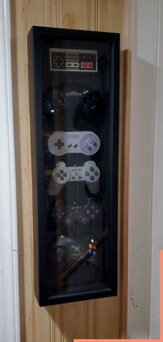 a wall mounted video game controller in a case