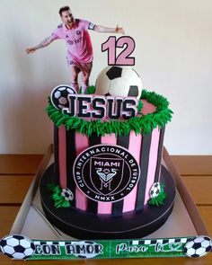 a birthday cake with a soccer player on top