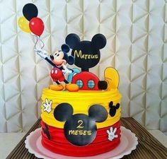 a mickey mouse birthday cake on a table