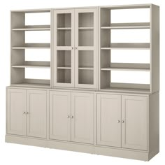 a white bookcase with doors and drawers