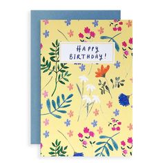 a yellow birthday card with colorful flowers and leaves on it that says happy birthday written in blue ink