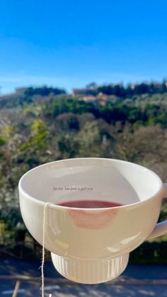 a cup of tea is sitting on a table