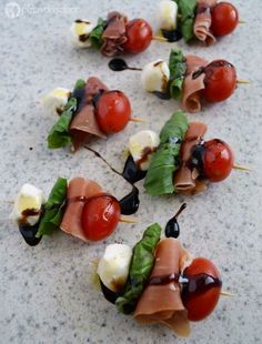 several skewers of meat and vegetables on toothpicks