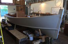 a boat is being built in a shop