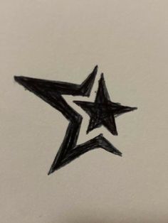 a black and white drawing of a star