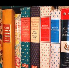 a row of books sitting on top of a shelf