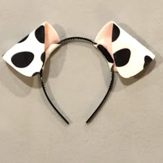 a minnie mouse ears headband with black and white polka dots